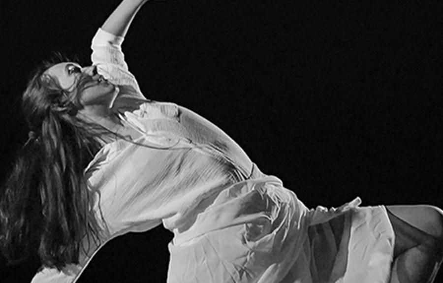 B&W image of PMA student Molly Hudson in a movement pose against a black background, as part of Yiqi (Coco) Tan’s first-prize winning dance film called Through the Eyes of a Child.