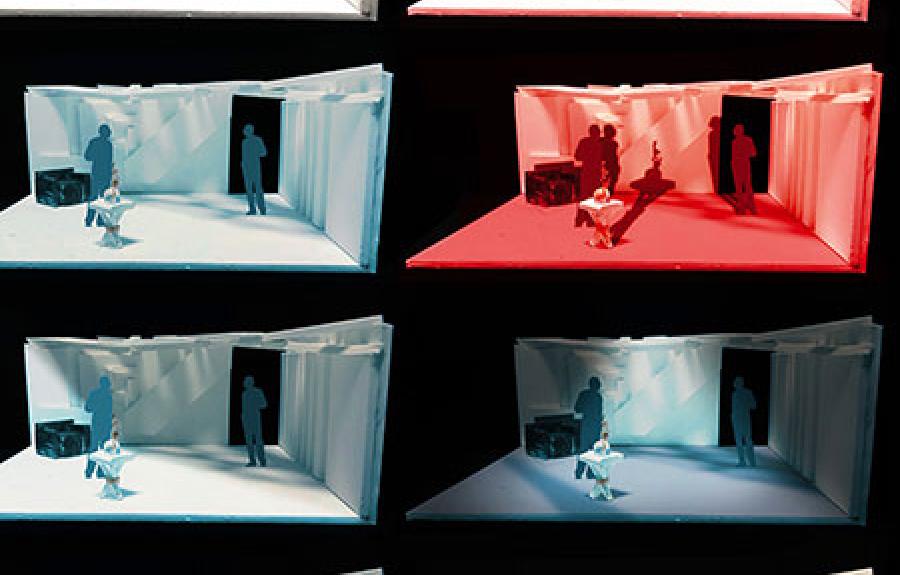 Model of a sparse room set design with two male figures, an armchair, and a side table with a vase. Eight versions of the set in different lighting are shown.