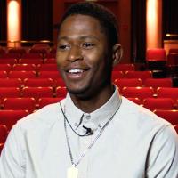 Photo of Trence Gilllem '22 sitting in the Kiplinger Theatre