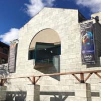 Stone exterior of Schwartz Center on a sunny day