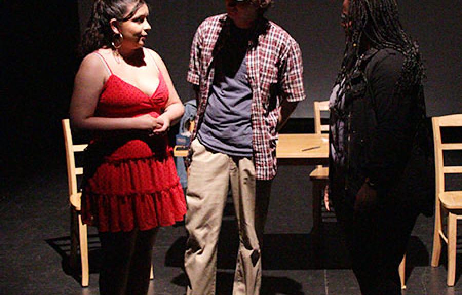 A photo of A Chicano&#039;s Guide to Navigation with three actors on stage