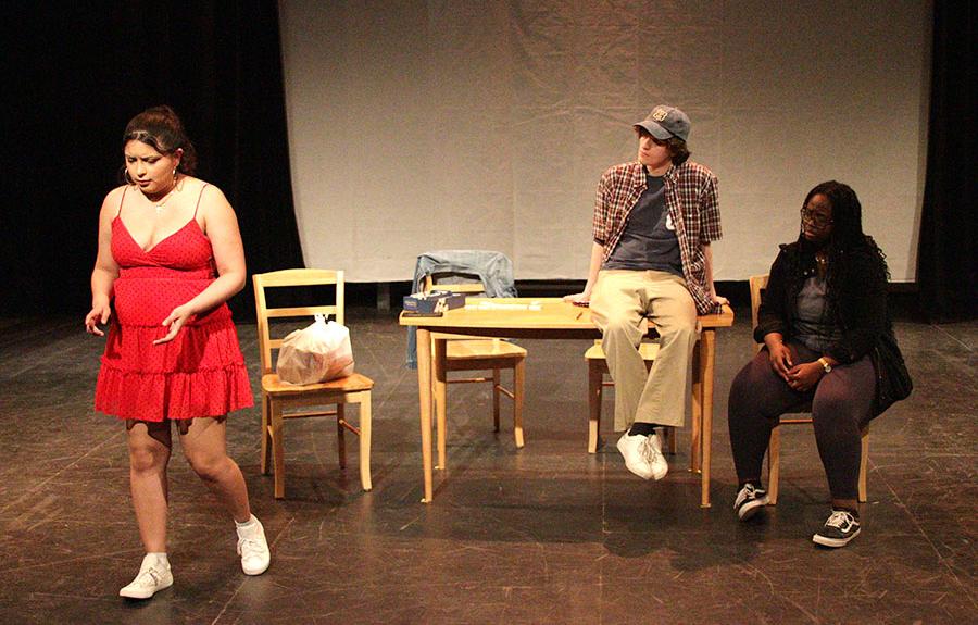 Photo A Chicano's Guide to Navigation performance with three people on stage