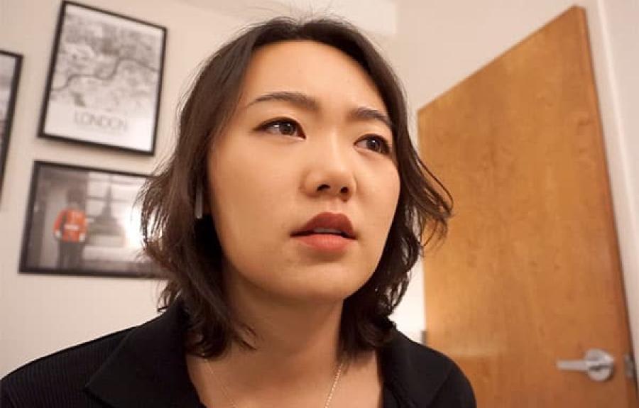 Young woman looking concerned in a room