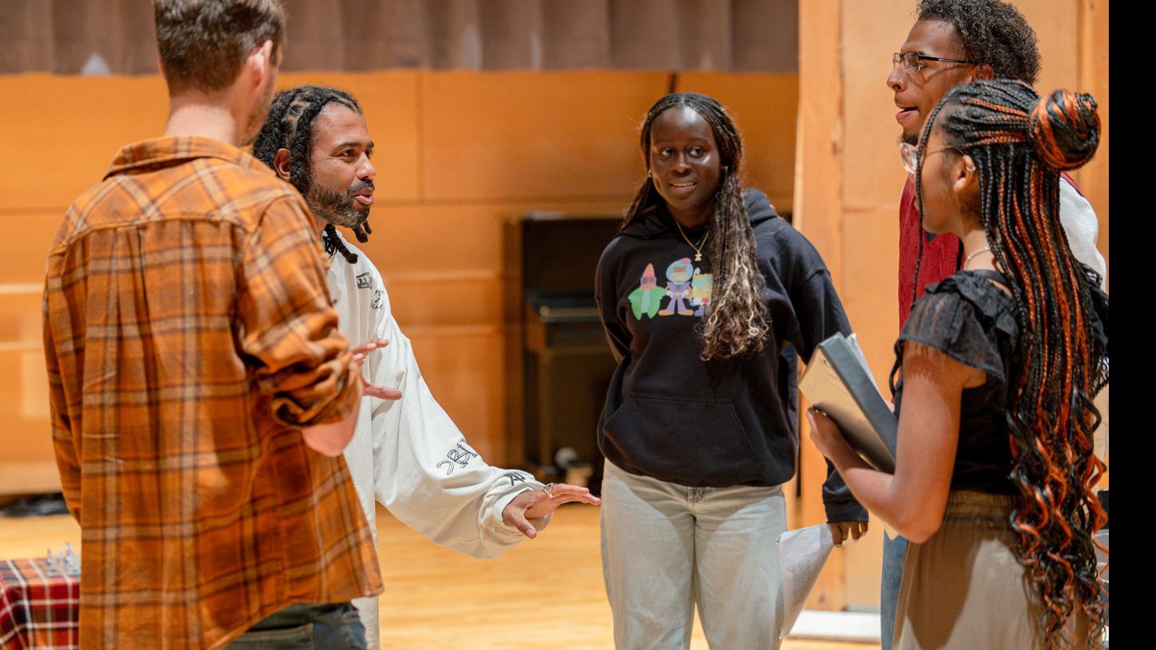 Daveed Diggs speaks with a semi-circle of three students and PMA Senior Lecturer Theo Black in the Class of ’56 Dance Studio Theatre.