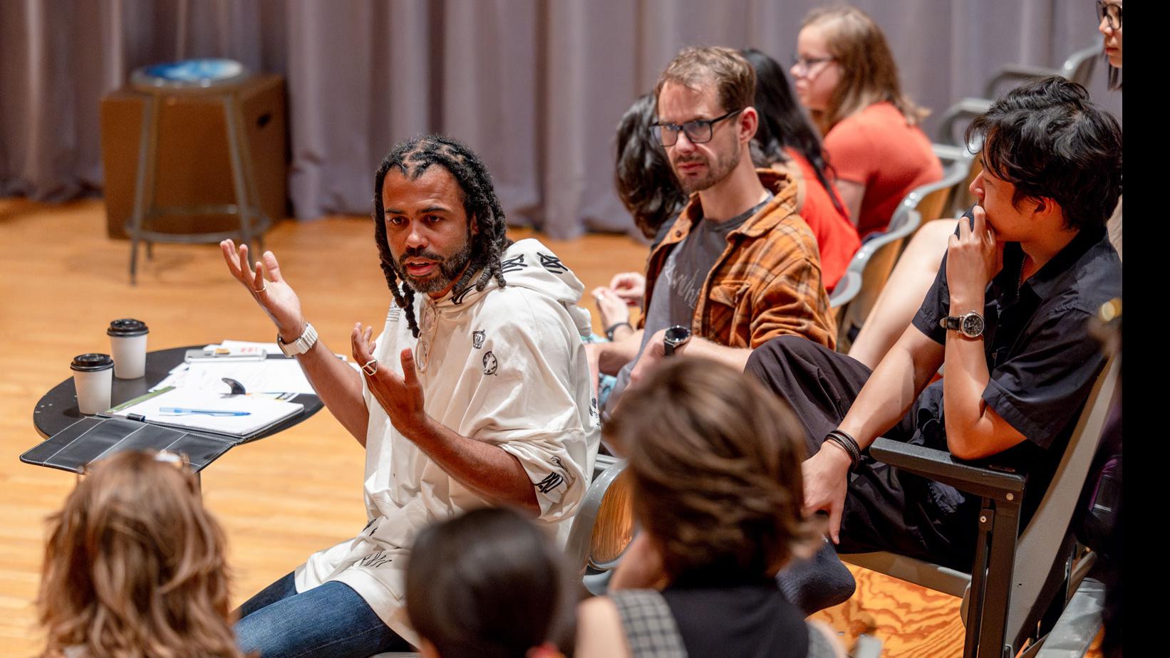 Daveed Diggs speaks with students, while Diggs, PMA Senior Lecturer Theo Black, and students are seated in the audience in the Class of ’56 Dance Studio Theatre.