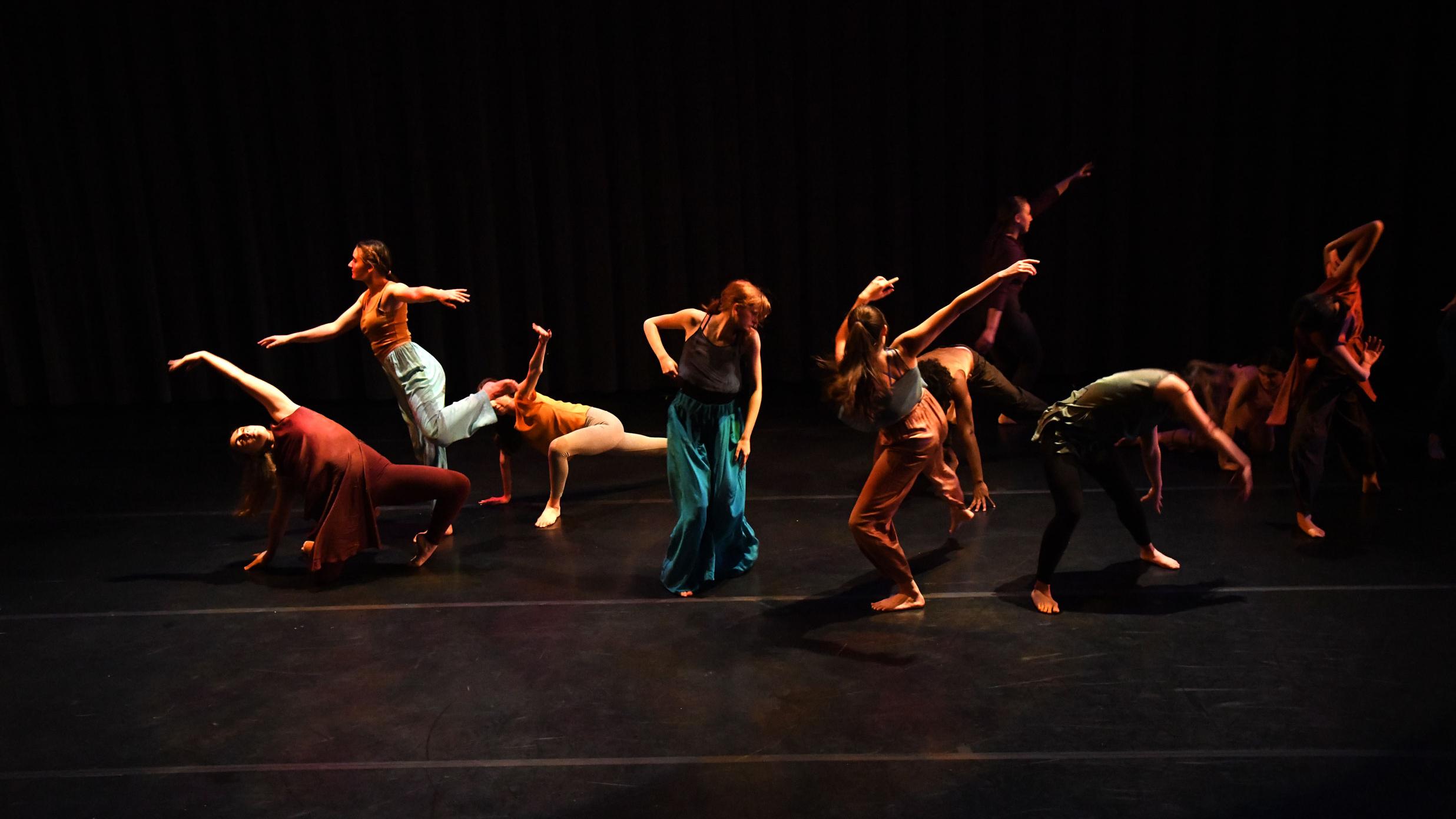 A group of people dancing on a stage