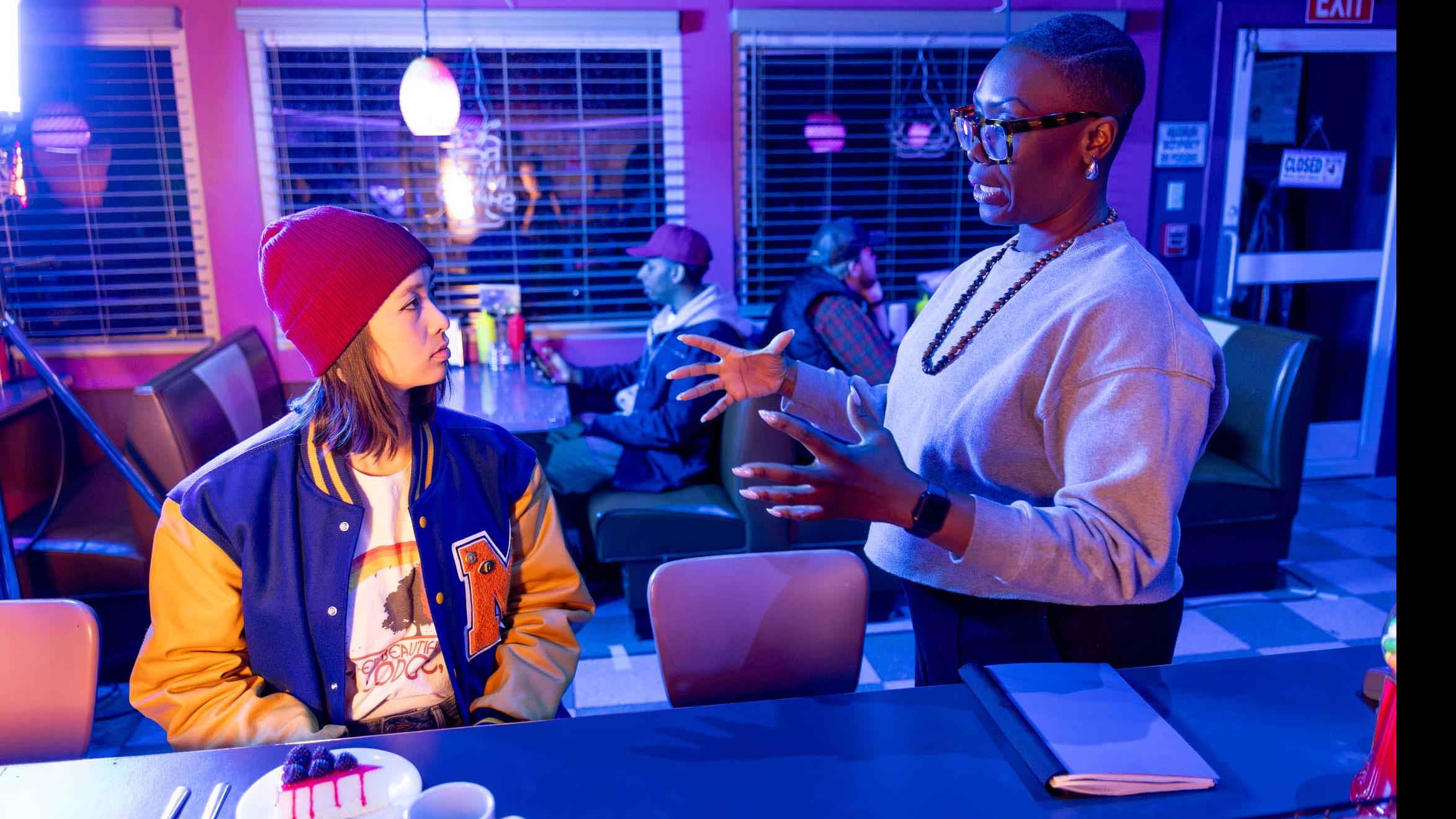 PMA Visiting Lecturer Carolyn Michelle Smith speaks with a student actor at the counter on the set of the PMA Studios short film Milkshake Kiss. Photo credit: Simon Wheeler