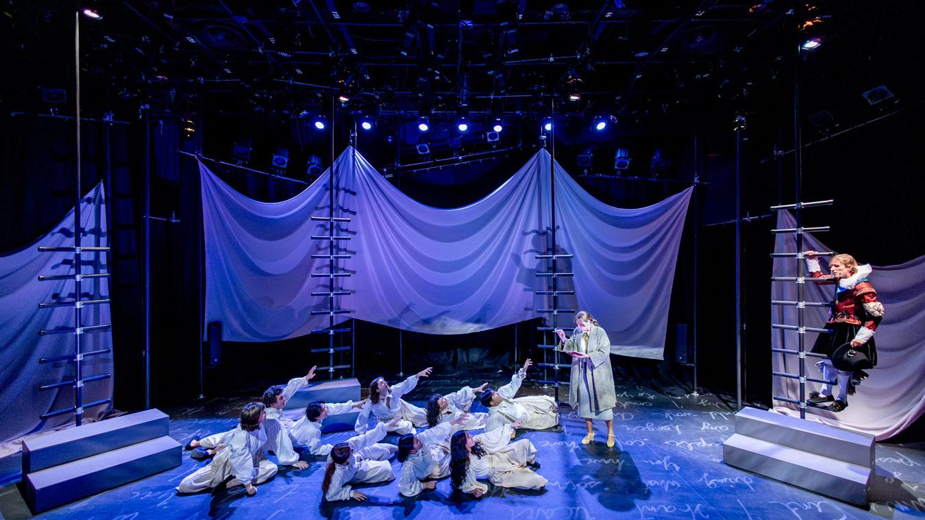 A group of students on stage rehearsing for a play, Orlando's Gift, in the Flex Theatre