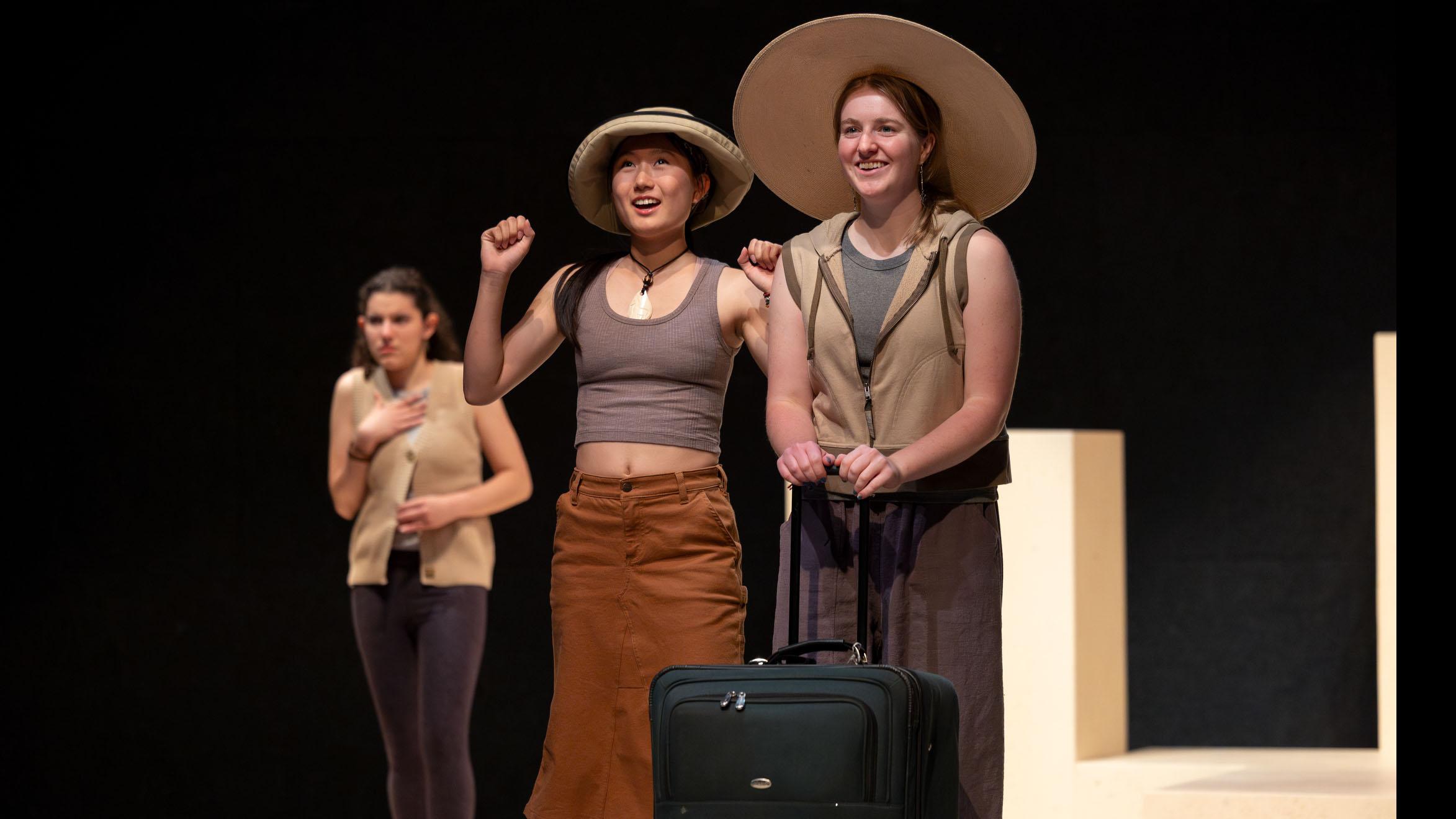 Three cast members look out during a performance of I Want a Country in the Flex Theatre, Schwartz Center for the Performing Arts.