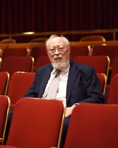 A person sitting in a theater