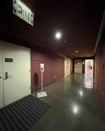 Class of ’56 Flexible Theatre double doors on the main floor of the Schwartz Center for the Performing Arts lobby, with the scene shop in the background.