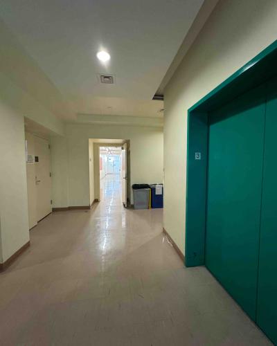 Elevator on the third floor of the Schwartz Center for the Performing Arts, with a doorway leading to the bathrooms, locker rooms and emergency exit stairs in the background.