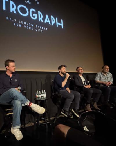 director John Krokidas, actors Daniel Radcliffe, Dane Dehaan, and Ben Foster, and producer Christine Vachon speaking on stage at The Metrograph NYC