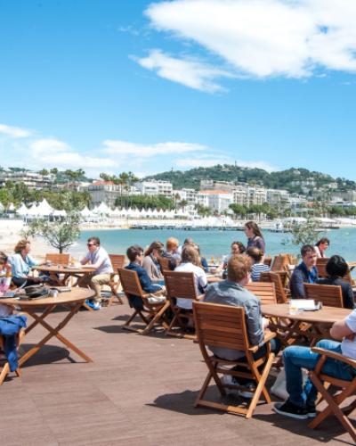 A group of people sitting at tables