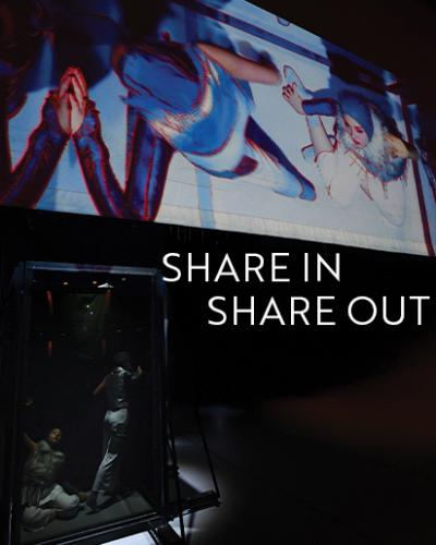 Two students inside a transparent structure in movement poses, with their images also projected on a screen. Share In/Share Out: End-of-Semester PMA Dance Showcase.