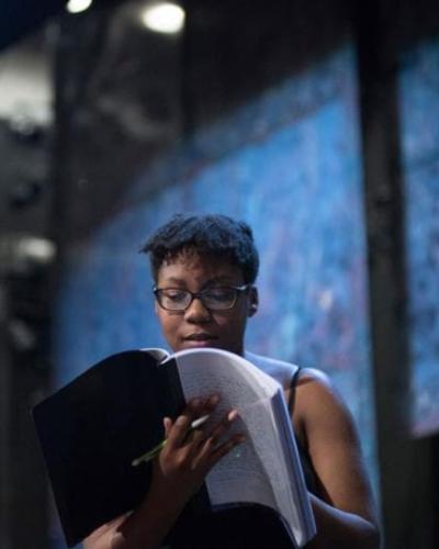 Carley Robinson &#039;21 holds a script in rehearsal for Mr. Burns, a post-electric play in 2018.
