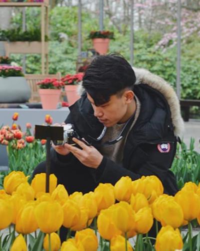 Richard Sun photographing flowers