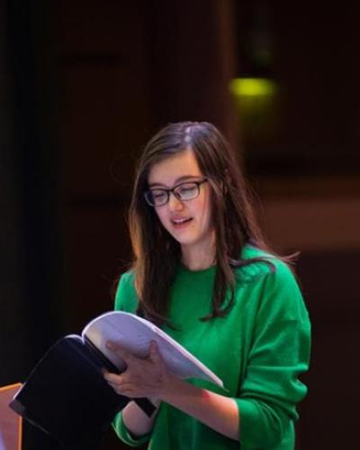 Actor studying a script in rehearsal