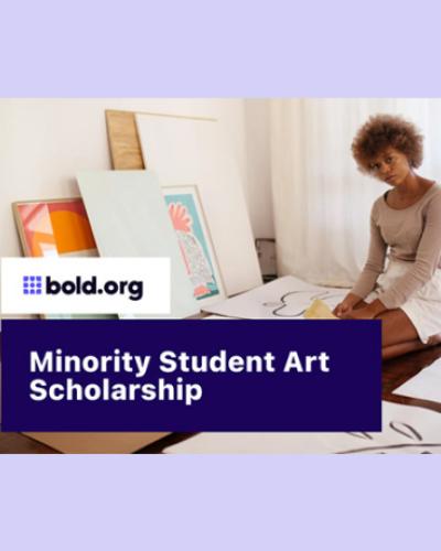 Young black woman sits on floor surrounded by artwork